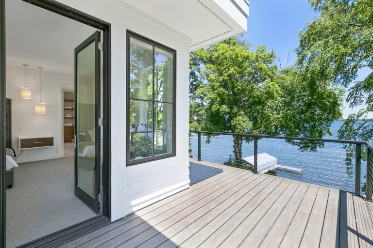 Trees and water surround this gorgeous new home